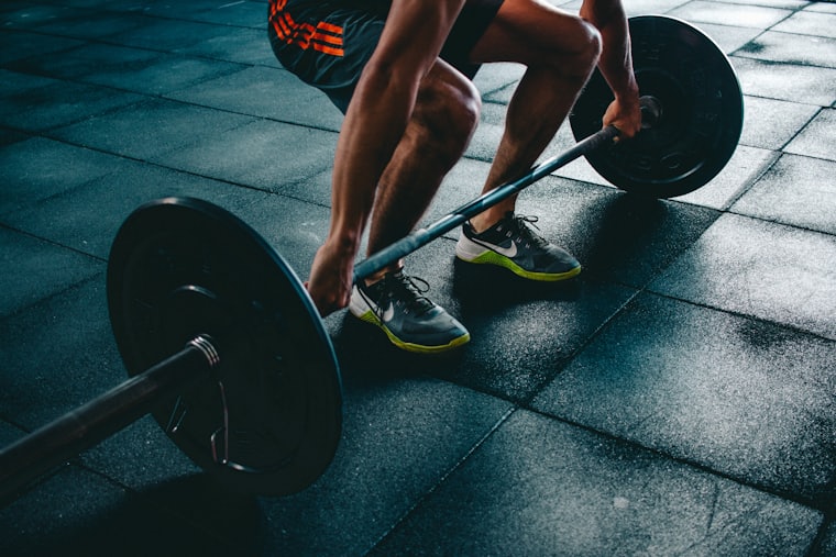 Athlete pausing between sets in the gym